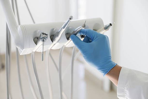 Professional Root Canal Treatment technician working in Greenville, MS